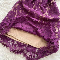 Purple lace fabric on a white background