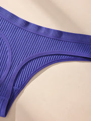 Blue ribbed underwear on a beige background