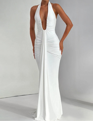 White halter neck gown on a model against a gray background