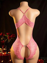 Pink lace lingerie set on a mannequin against a dark background with red roses.