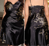 Black satin dress with floral embroidery on a person, shown from front and back views.