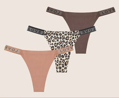 Three pairs of women's panties with rhinestone accents on a beige background.