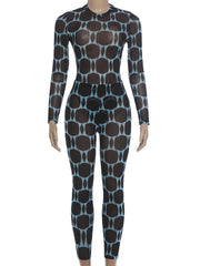 A long-sleeve, full-length bodysuit or wetsuit with a black base and a repeating light blue abstract oval pattern, displayed on a mannequin against a plain white background.
