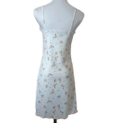 Light blue dress with floral pattern on a mannequin against a white background