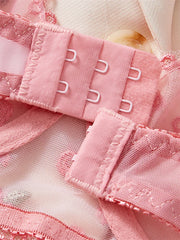 Close-up of pink fabric with metal gussets