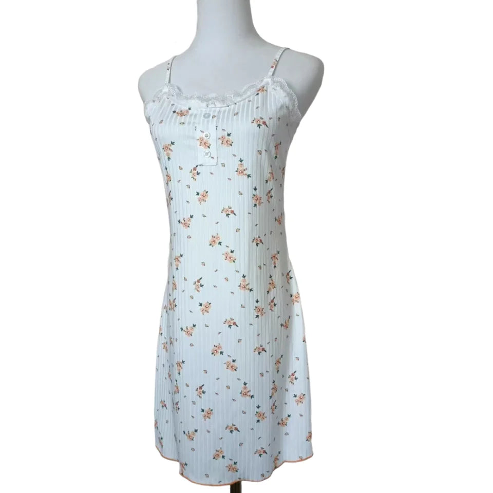 Floral dress on a mannequin against a white background