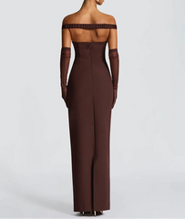 Woman wearing a brown off-shoulder evening gown with long gloves on a white background