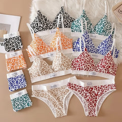 Collection of patterned bras and panties on a brown background