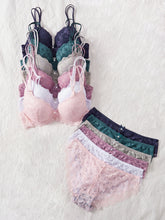 Colorful lingerie set including bras and panties on a white background