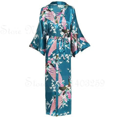Teal satin robe with floral and bird pattern on a white background