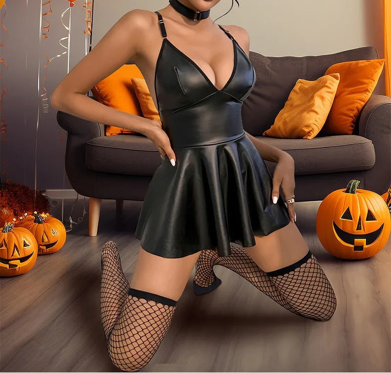 Woman in a black dress with Halloween decorations in the background