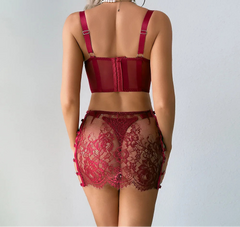 Red lace lingerie set on a plain background