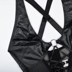 Black leather harness on a white background