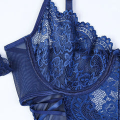 Blue lace lingerie set on a white background