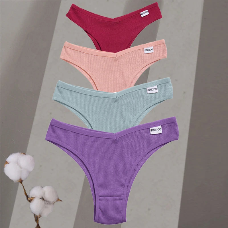 Four pairs of colorful underwear on a gray background with a cotton plant.