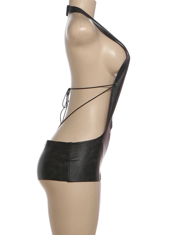 Black leather outfit on a mannequin against a white background