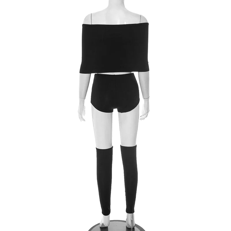 Mannequin wearing a black off-shoulder top and shorts set on a white background