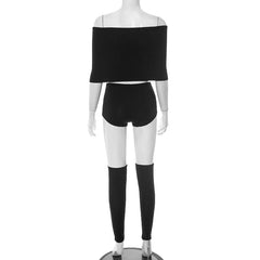 Mannequin wearing a black off-shoulder top and shorts set on a white background