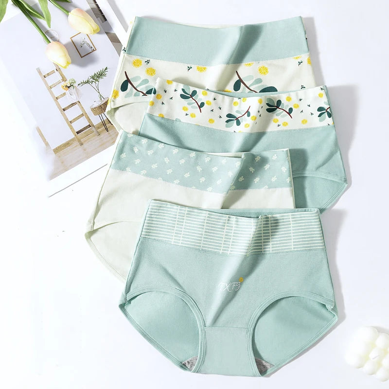 4 Set of light green women's underwear with floral waistband on a white background