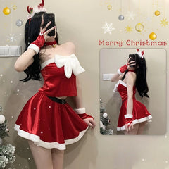 Person in a red Christmas costume taking a mirror selfie with festive decorations.