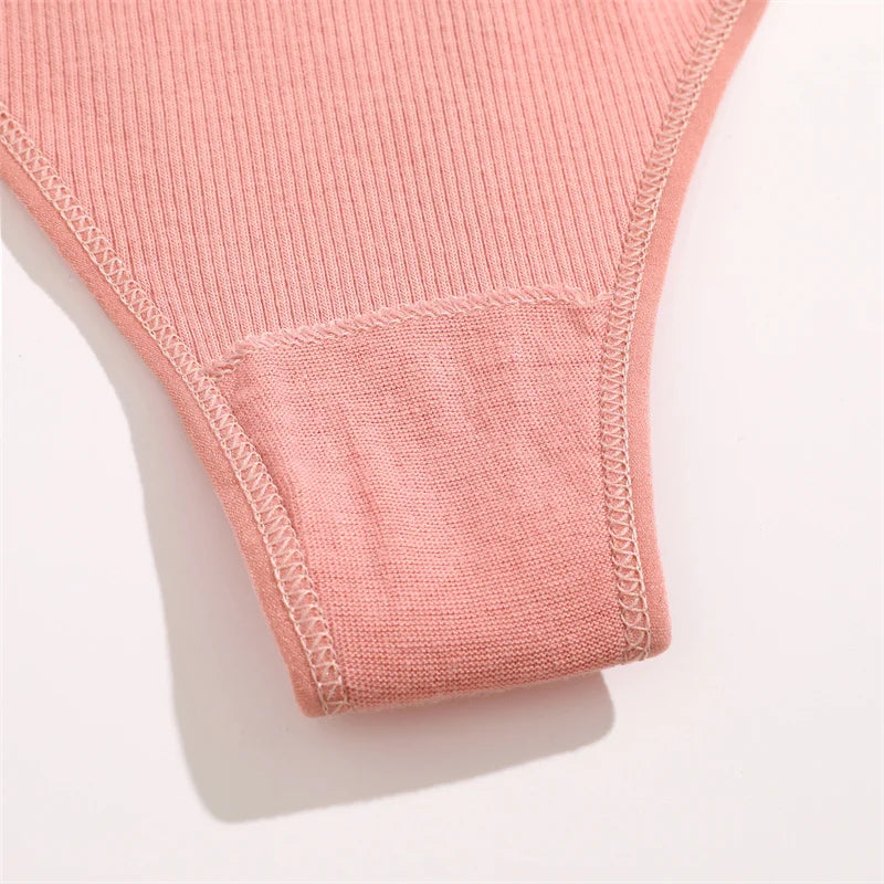 Close-up of a pink ribbed fabric sleeve on a light background