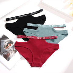 Four pairs of underwear in black, red, green, and blue with 'FINE TOO' branding on the waistbands.