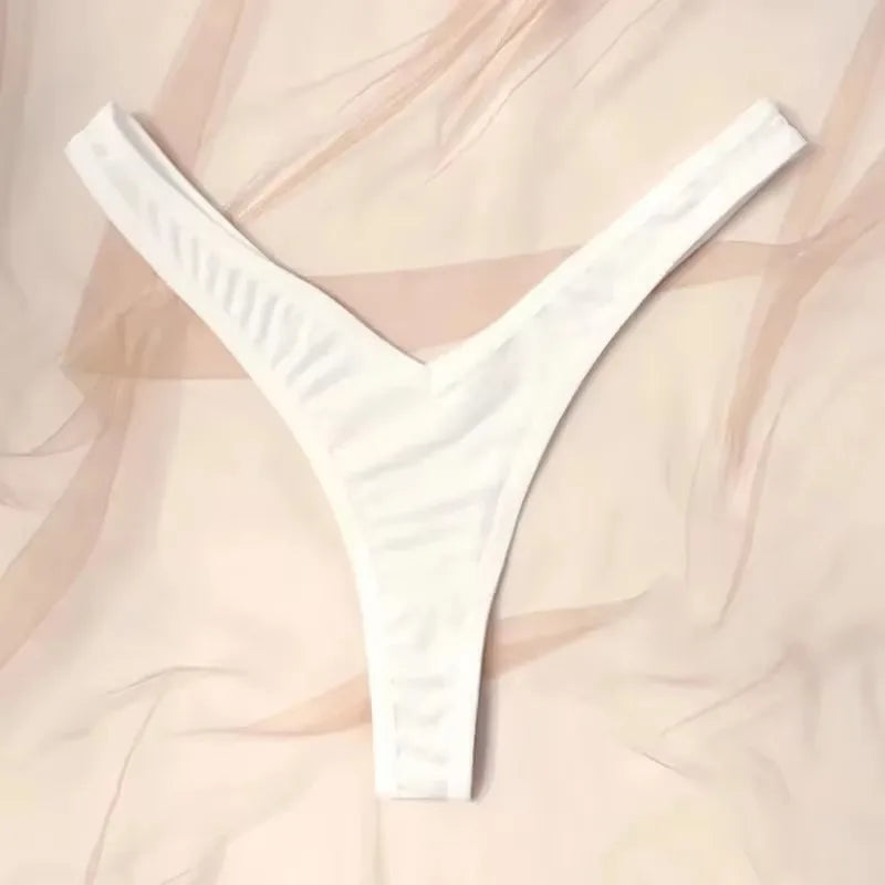 White thong against a soft pink background