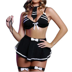 Black and white maid costume with bow details on a model against a white background
