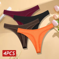 Four pairs of colorful thongs on a beige background with flowers.