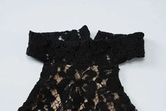 Black lace dress on a white background
