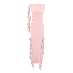 Pink two-piece outfit with ruched top and frayed skirt on a white background