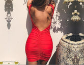 This image features the V Neck Backless Sexy Bodycon dress, showcasing a sleek and seductive design ideal for special occasions. The dress is crafted from polyester, providing a smooth texture and sheath-like fit that enhances the body shape.