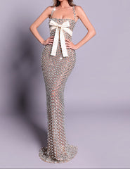 Elegant evening gown with a white bow on a gray background