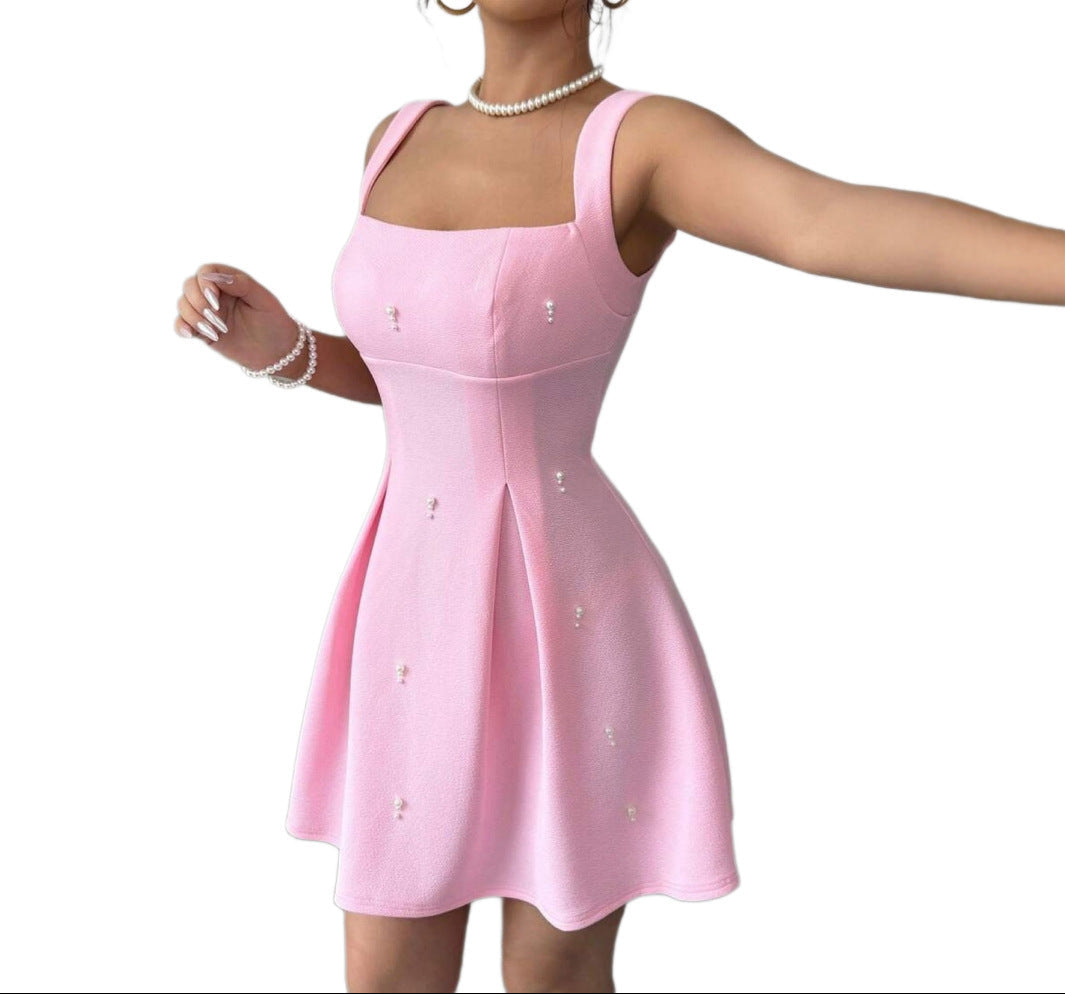 Pink dress with buttons on a white background