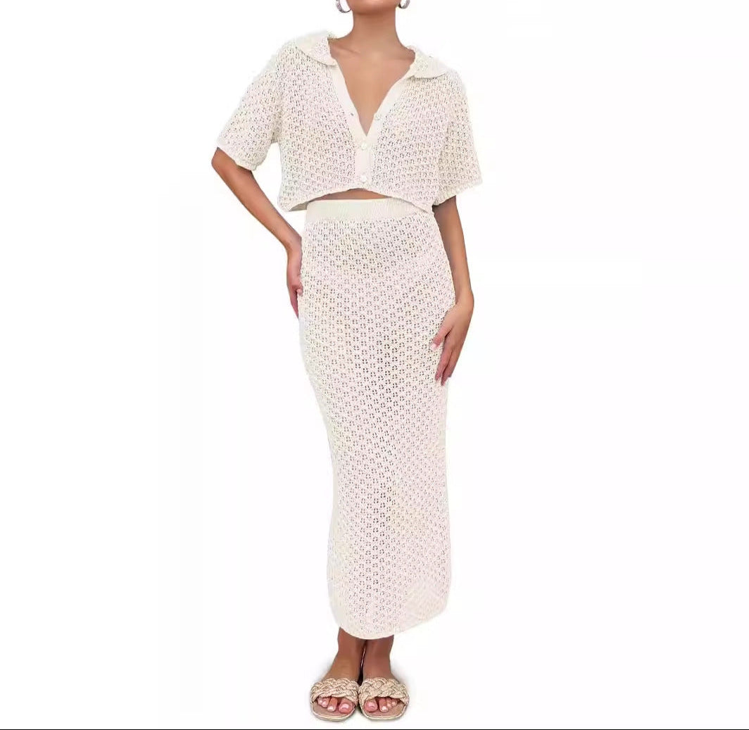 Woman wearing a white crochet two-piece outfit on a white background