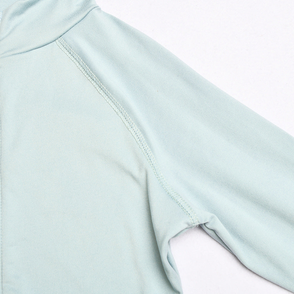 Close-up of a light blue athletic shirt with a white background