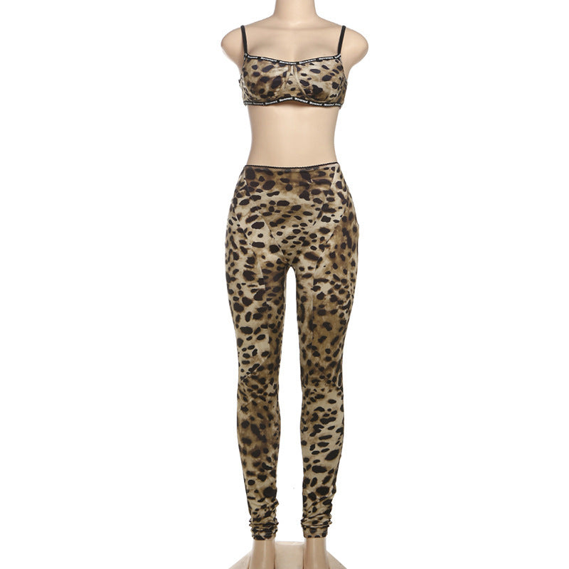 Leopard print sports bra and leggings set on a mannequin against a white background