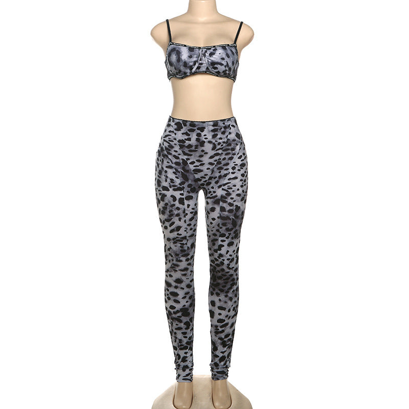 Mannequin wearing a leopard print sports bra and leggings set on a white background