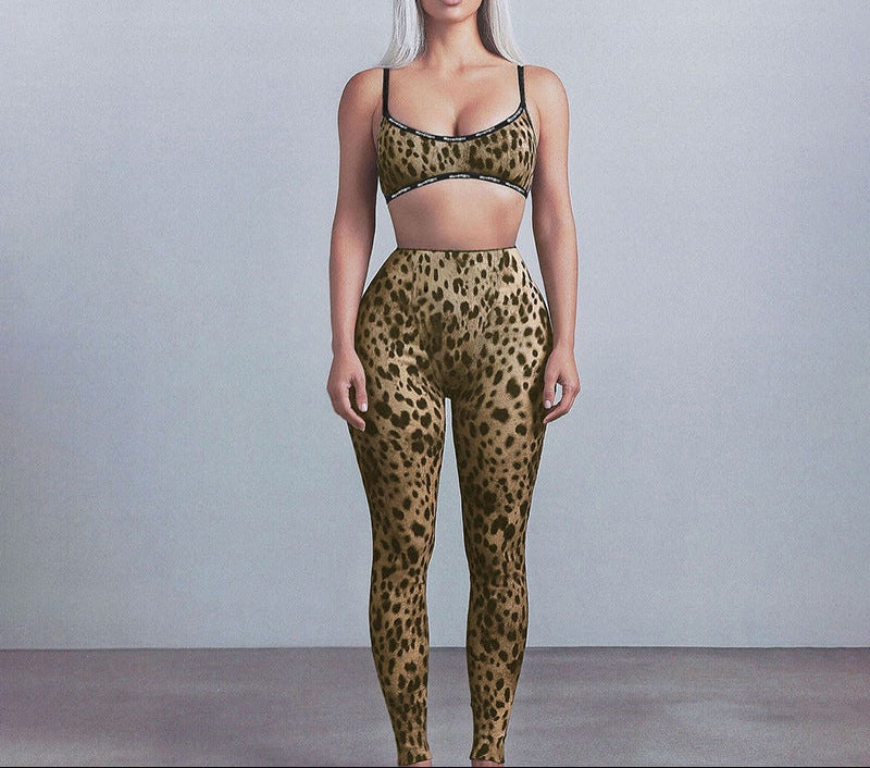 Person wearing a leopard print sports bra and leggings set against a plain background