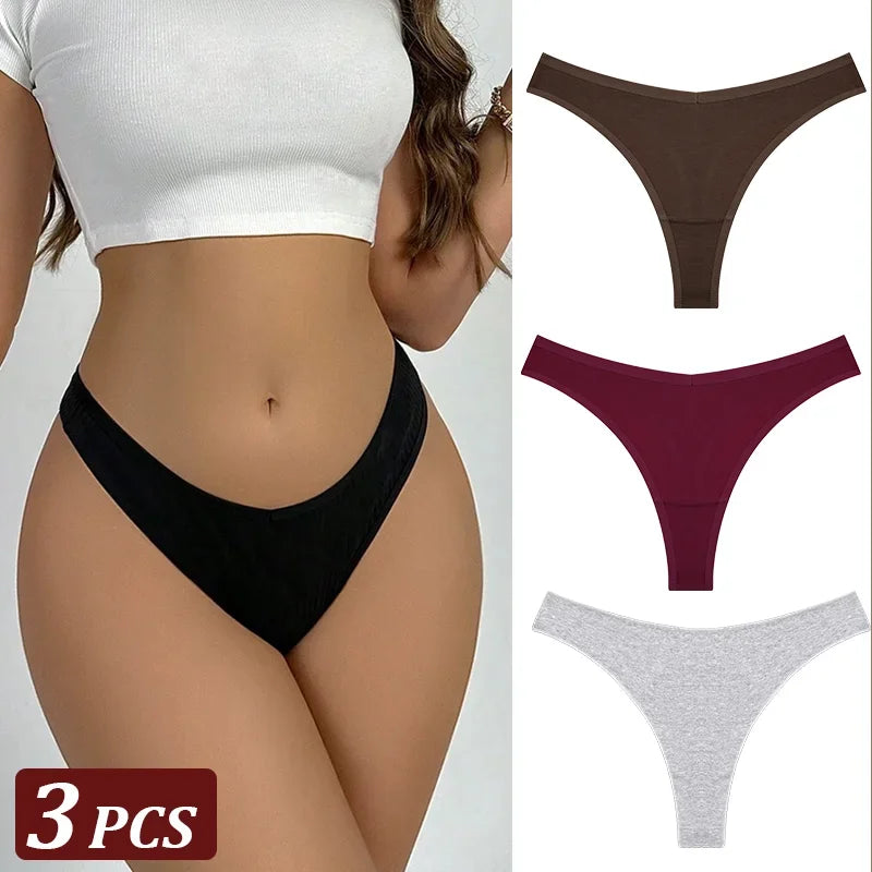 Black thong worn by a person with additional thongs in brown, red, and gray displayed on the right.