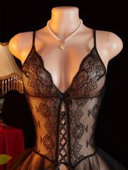 Mannequin wearing a black lace lingerie set with a blurred background