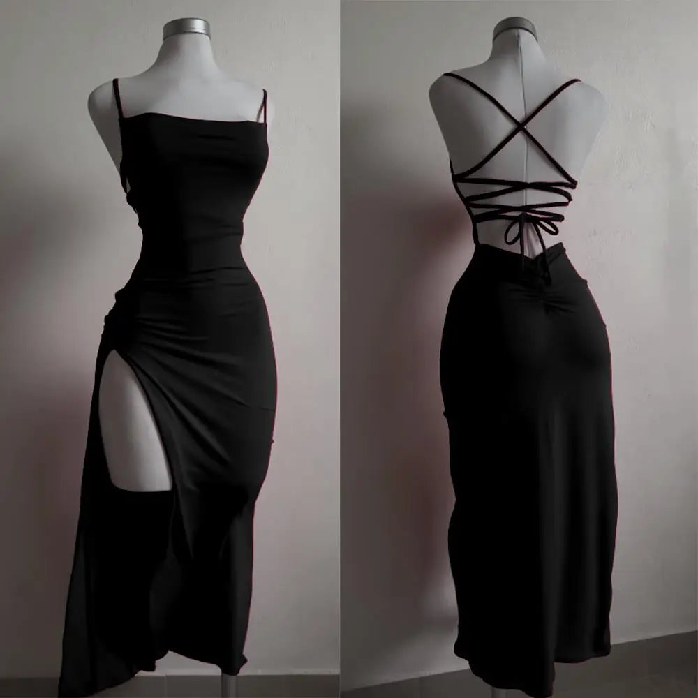Black dress with a front slit and criss-cross back on a mannequin against a neutral background