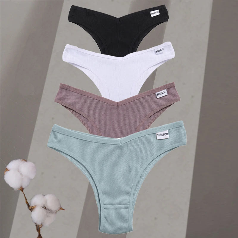 Four pairs of underwear in black, white, brown, and green on a gray background with cotton branches.