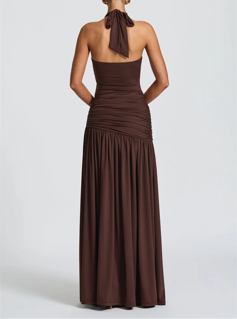 Brown halter neck gown on a white background