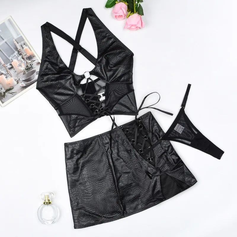 Black lingerie set with a skirt on a white background