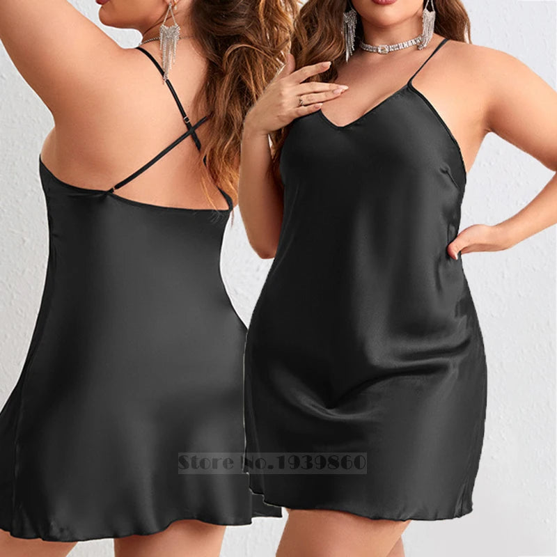 Two women wearing black satin nightgowns against a plain background