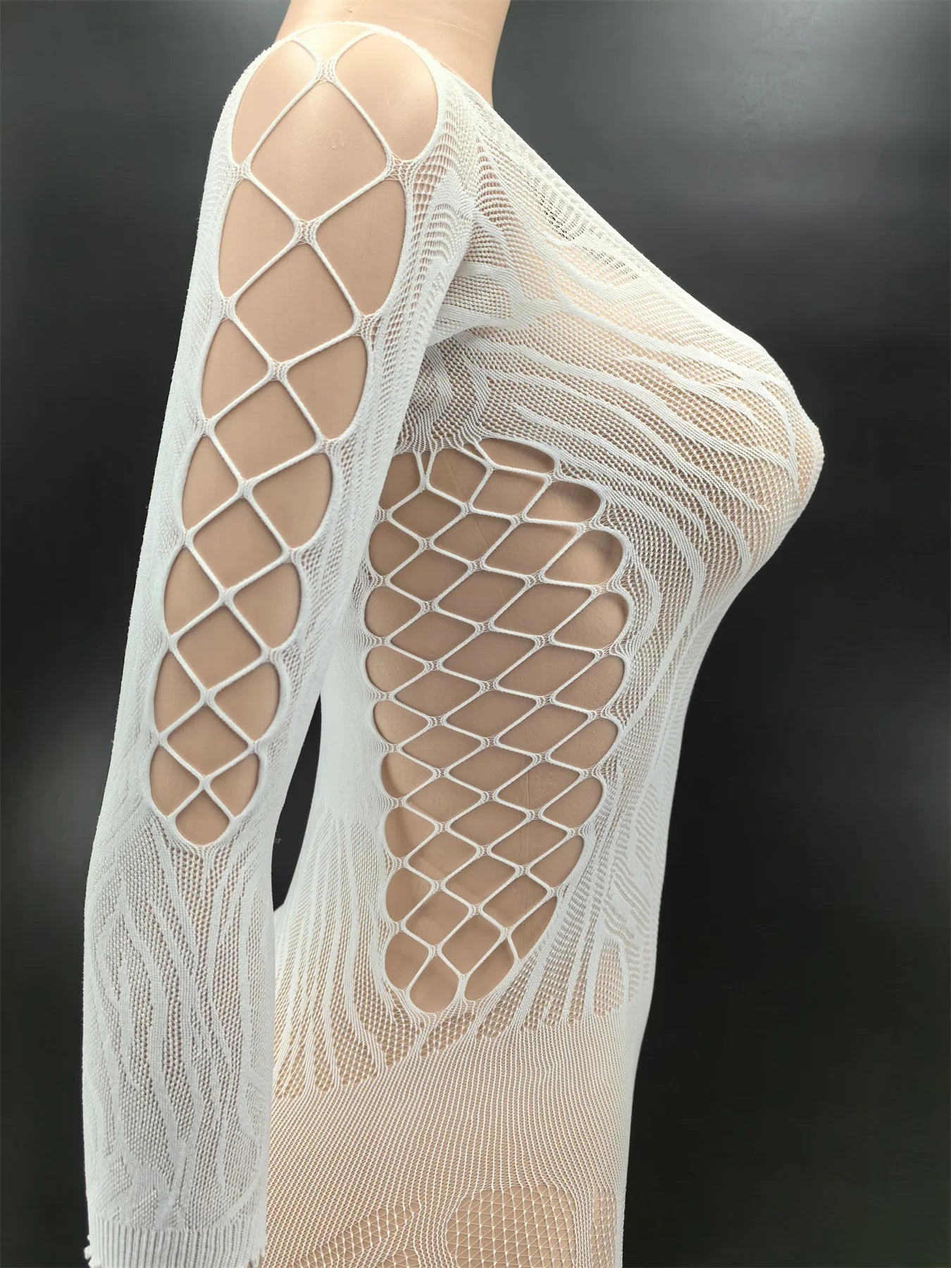 Beige fishnet stockings on a black background