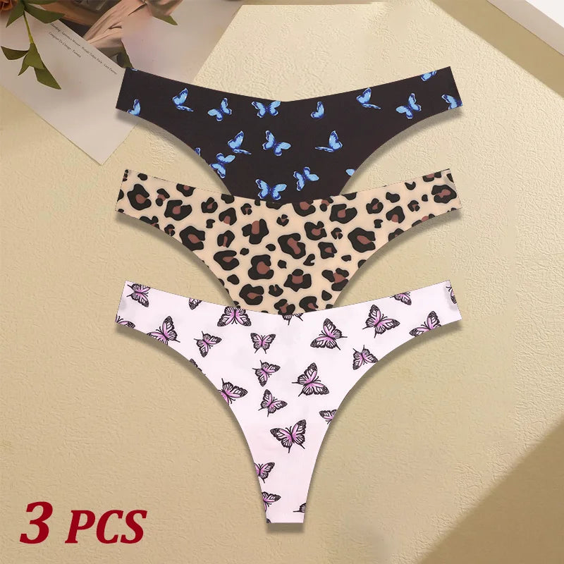 Three pairs of patterned underwear on a beige surface with '3 PCS' text.