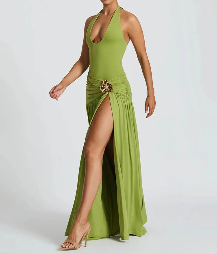 Green evening gown with a high slit on a white background