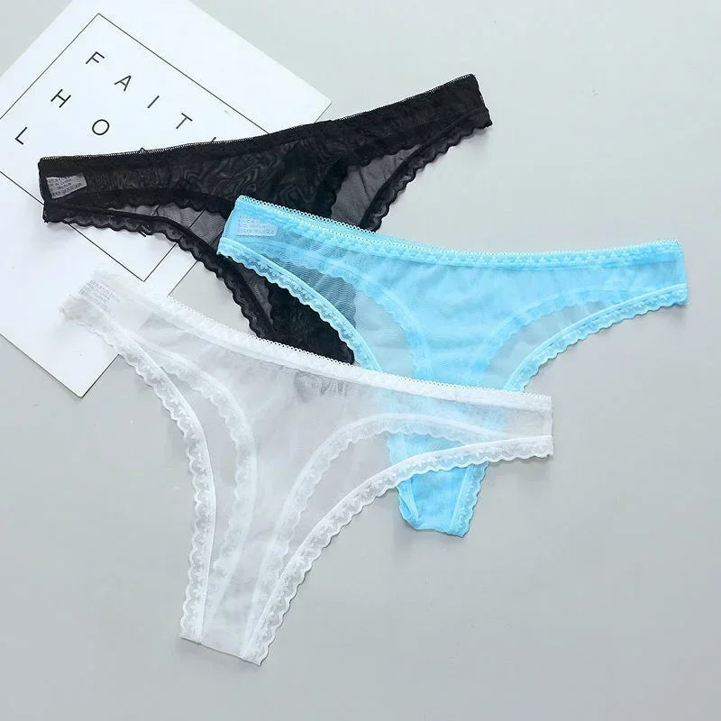 Three pairs of lace-trimmed panties in black, blue, and white on a light gray background.